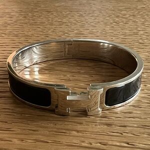 Hermes Silver Toned Black Ceramic Clic Clac Bracelet. 'H' closure.